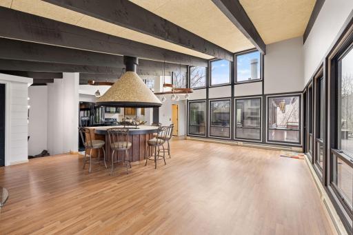 Full wall of windows, bringing in natural light and framing views of the St. Croix River