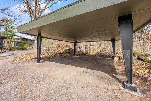 Newer driveway with spacious carport or opportunity to build garage