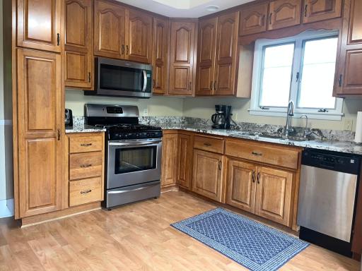 Kitchen conveniently located just a few feet from deck. Making entertaining much easier.
