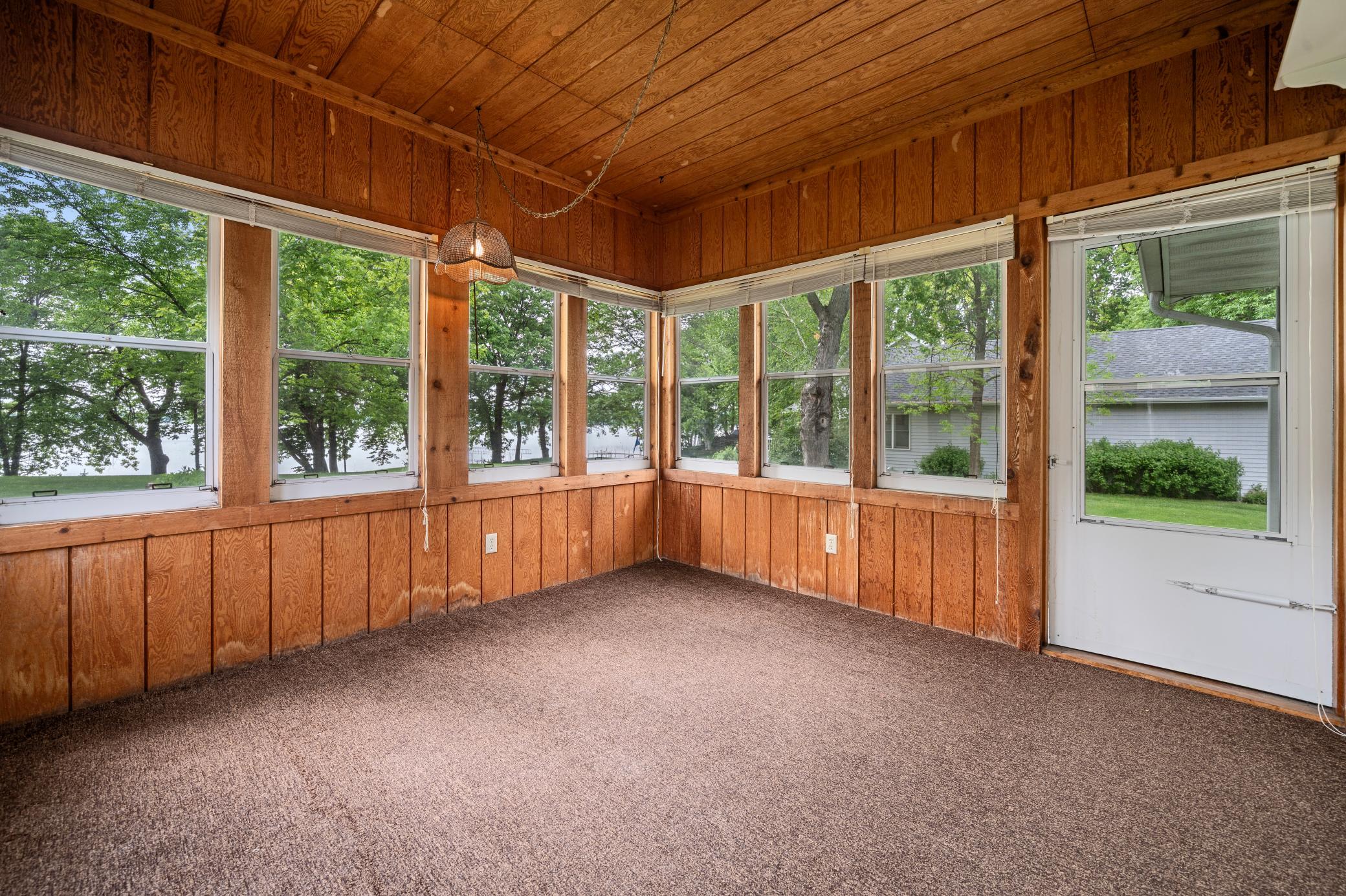 The porch offers a flexible space that can easily serve as extra guest quarters.