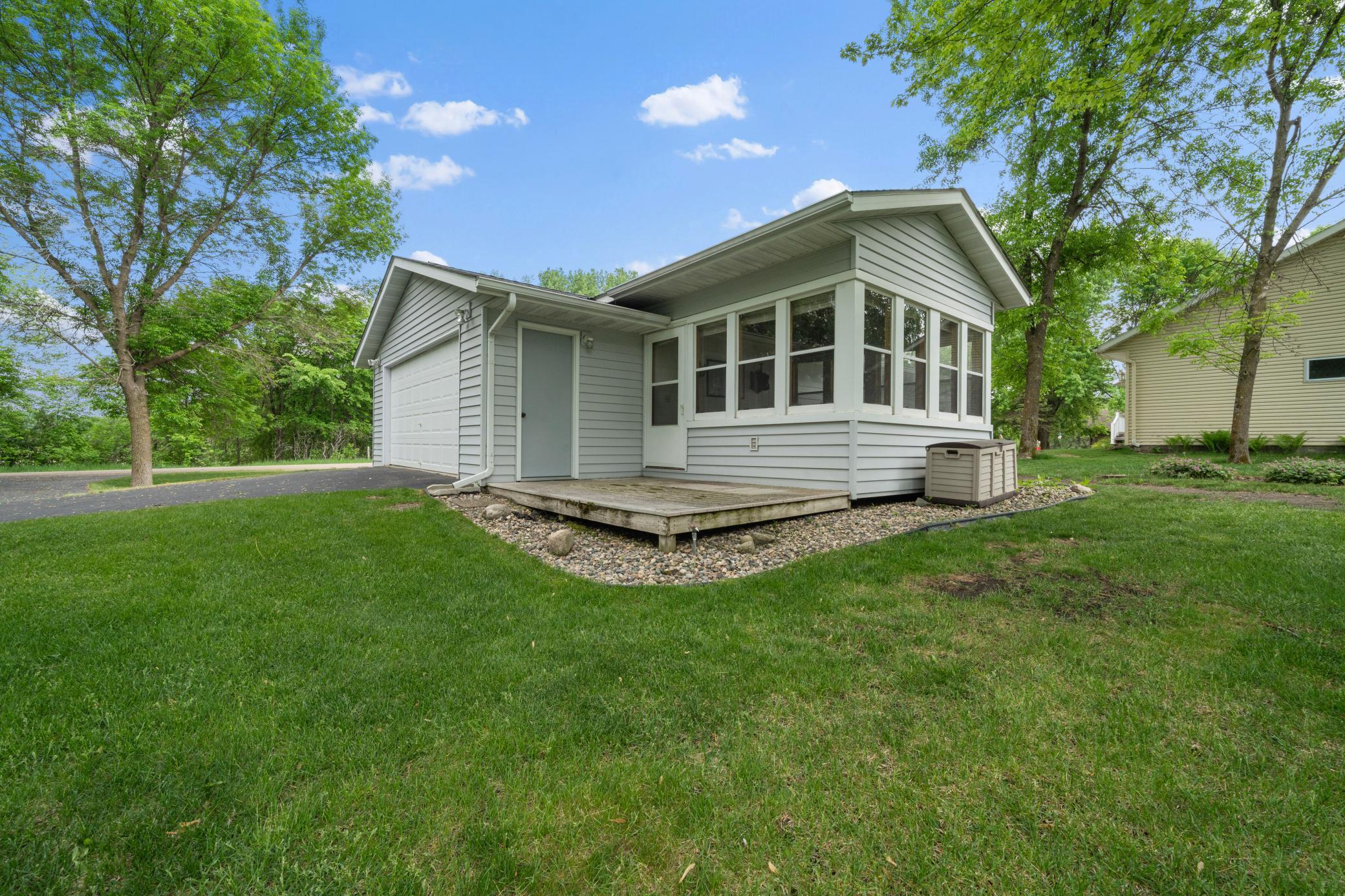 Detached 4-stall garage and porch.