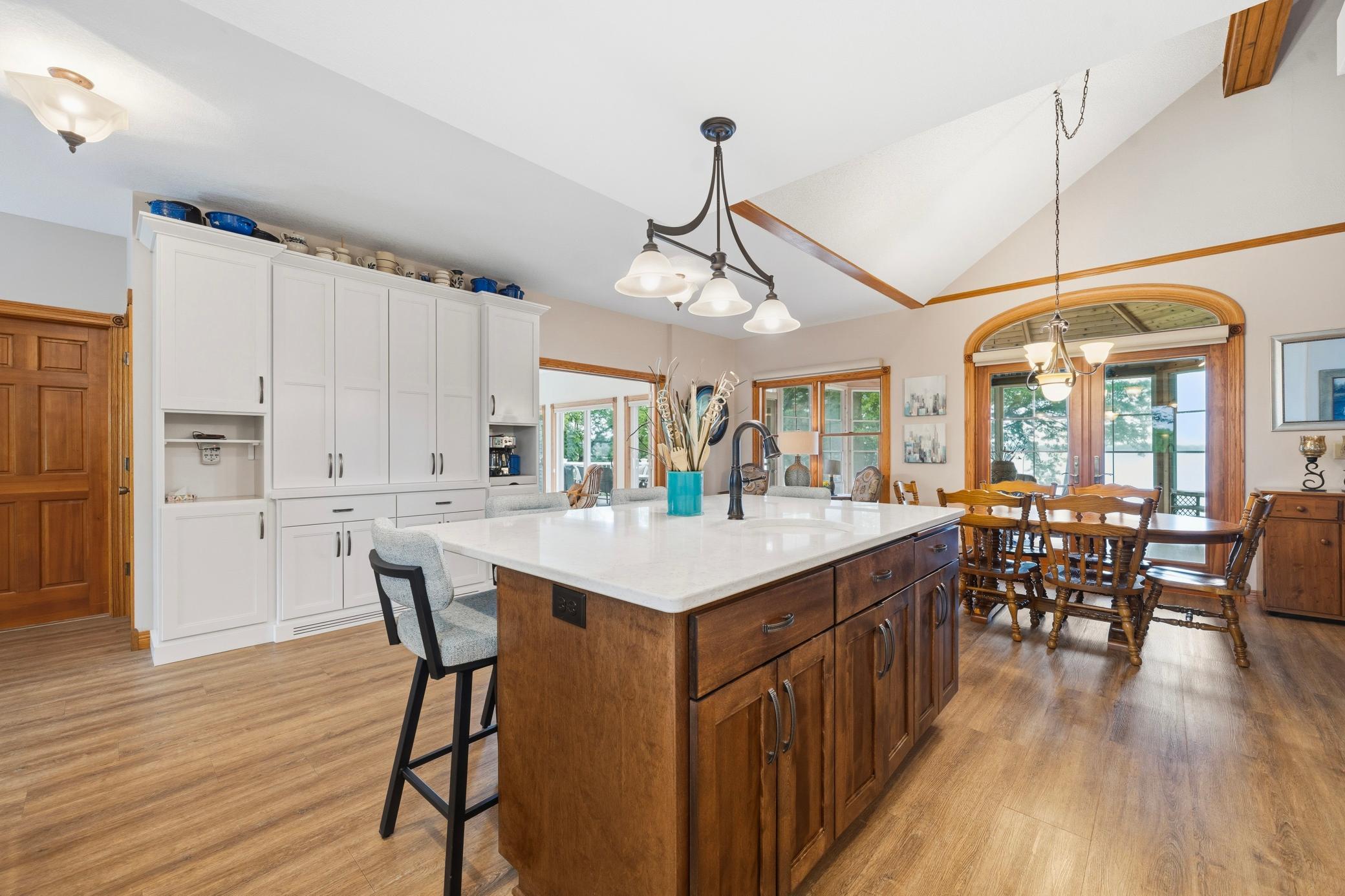 The center island provides additional storage and prep space while creating a natural gathering spot with casual seating.