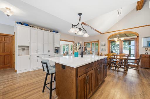 The center island provides additional storage and prep space while creating a natural gathering spot with casual seating.