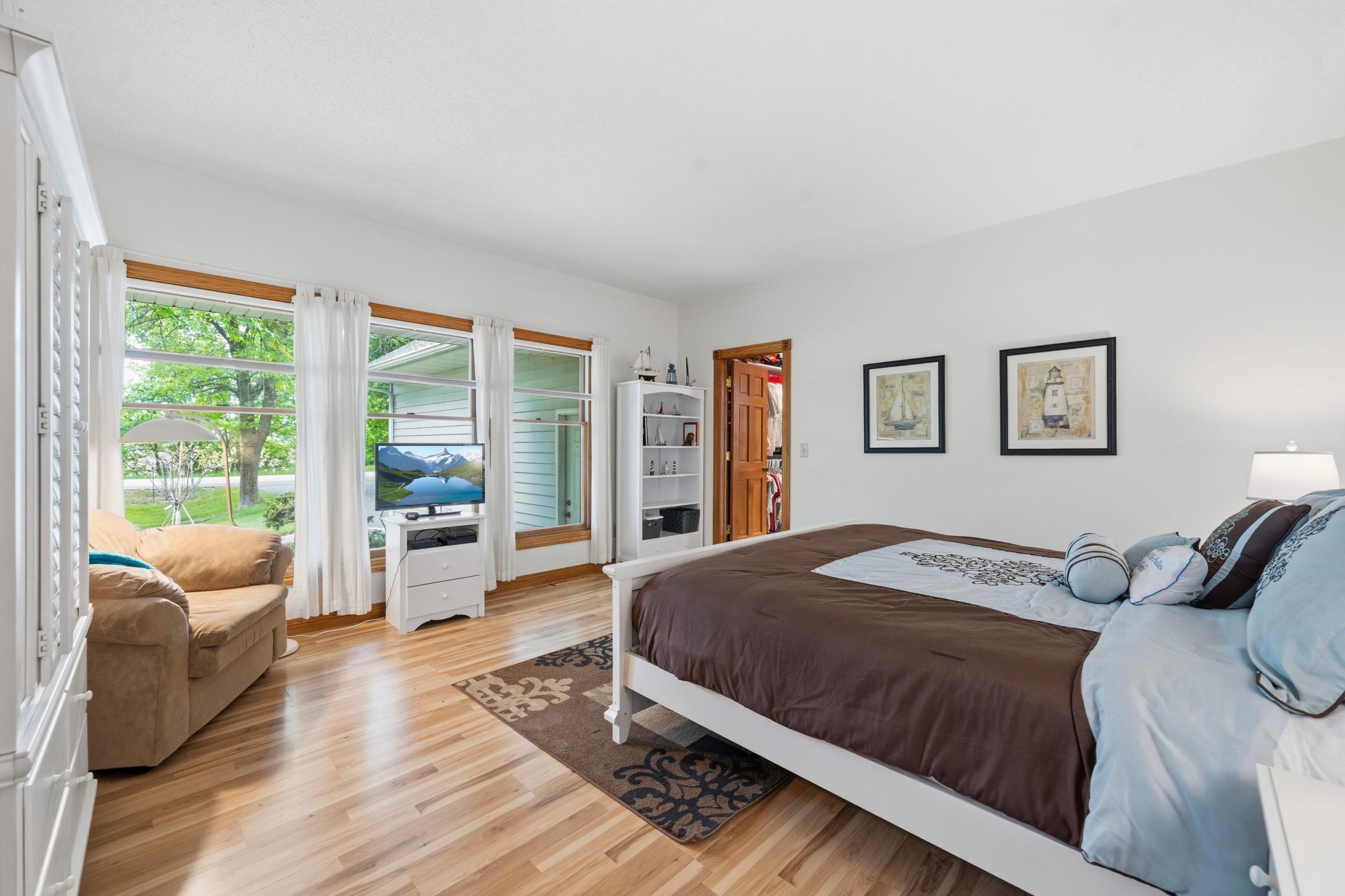 The primary bedroom is spacious with tons of natural light and neutral tones.