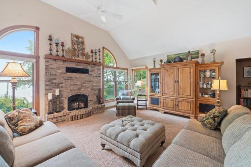 The living room is centered around a fireplace creating a cozy ambiance.