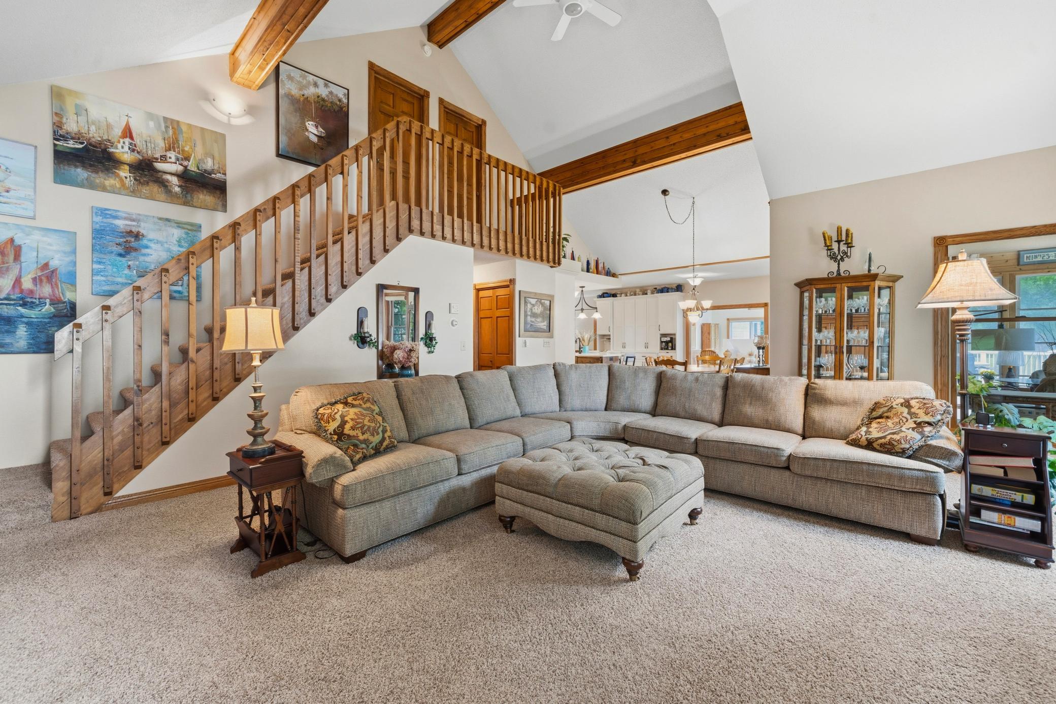 Soaring ceilings accented by wood beams add character to the space.
