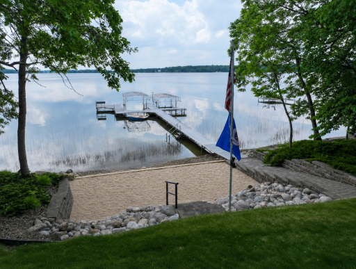 The sandy-bottom shoreline is perfect for swimming, boating, and endless days on the lake.