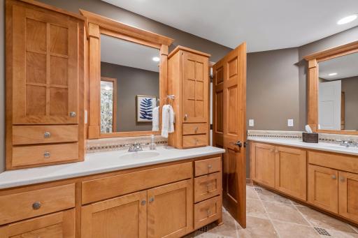 Designed with busy mornings in mind, the upper-level bath features two separate vanity areas along with a private bathing room, making it easy for multiple people to get ready at the same time.