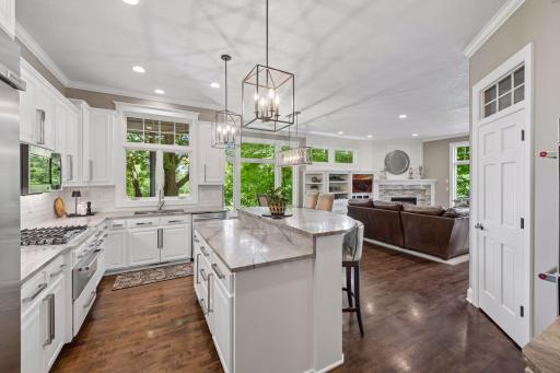 The spacious center island invites casual conversation, morning coffee, homework sessions, and appetizers before dinner.