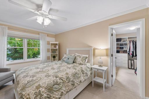 Just steps from the primary suite, this spacious bedroom offers the perfect balance of connection and privacy, with a walk-in closet and room to truly settle in.