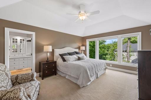 Spacious, serene, and filled with natural light, the primary suite is designed to be a true sanctuary, with elegant tray ceilings and a comfortable sitting area for quiet mornings or peaceful evenings.