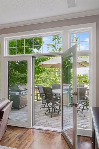 French patio doors extend the living space outdoors, leading to a generous cedar deck that's perfect for grilling, entertaining, or simply enjoying the quiet surroundings.
