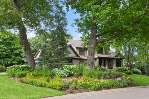 Perfectly positioned on a quiet cul-de-sac corner lot, the home makes a beautiful first impression with timeless architecture and meticulously maintained landscaping.
