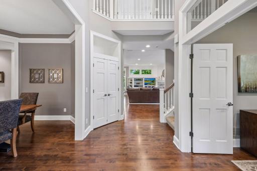 A dramatic two-story foyer creates a memorable first impression, where beautiful windows and sightlines set the tone for the light-filled spaces that unfold beyond.