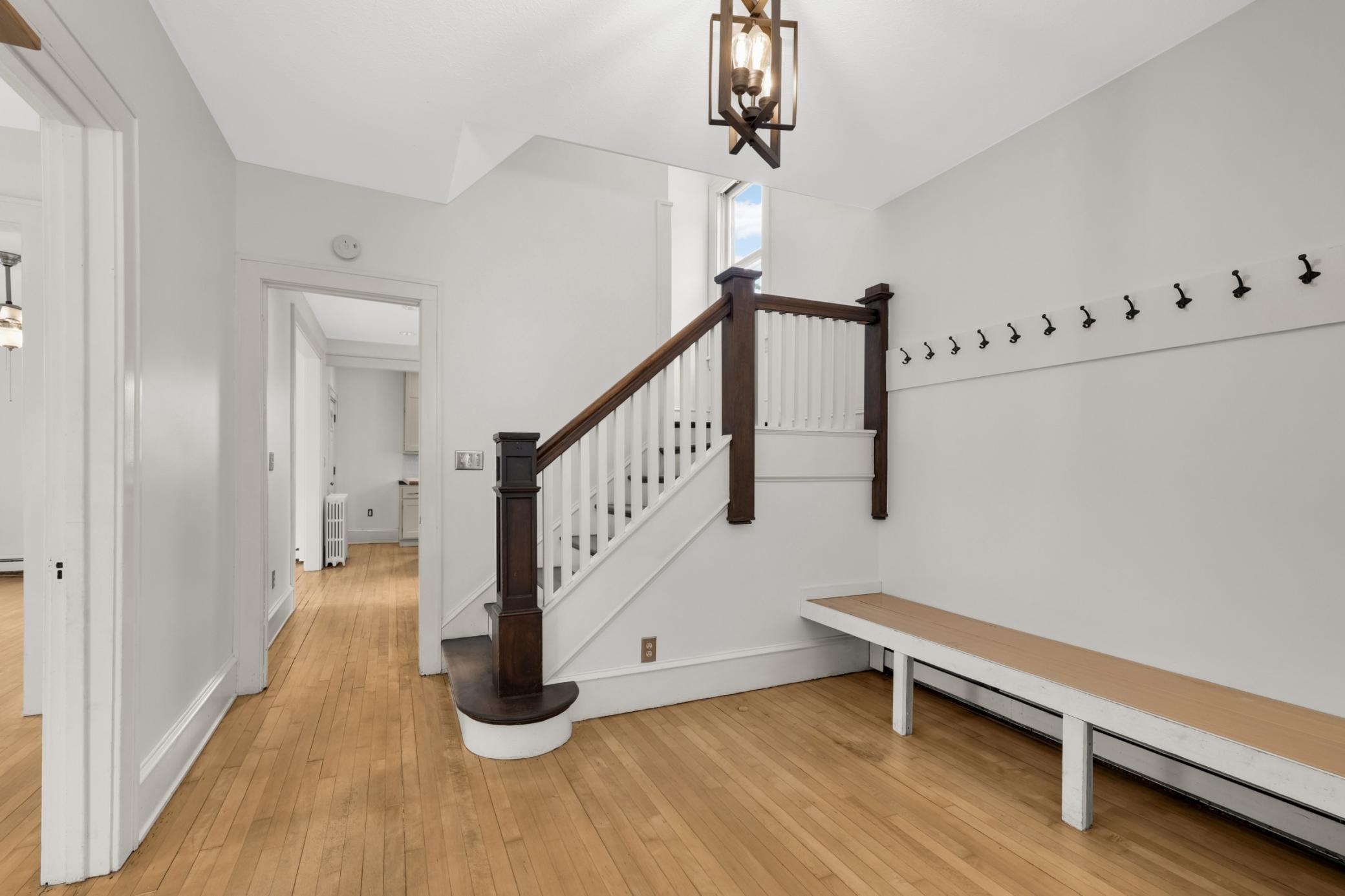 Stunning open staircase in the foyer leading to the upper level