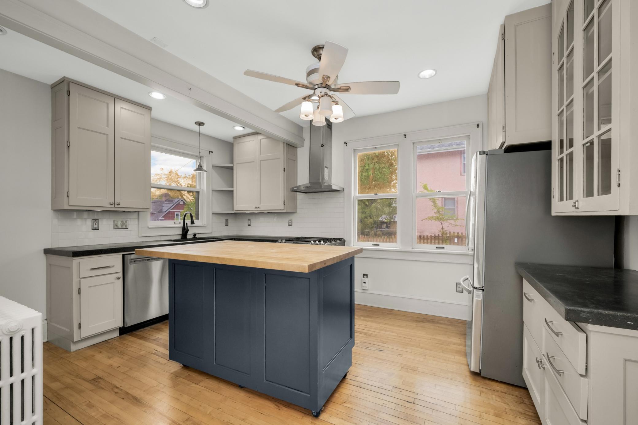 Gather around the convenient island in the gorgeous kitchen
