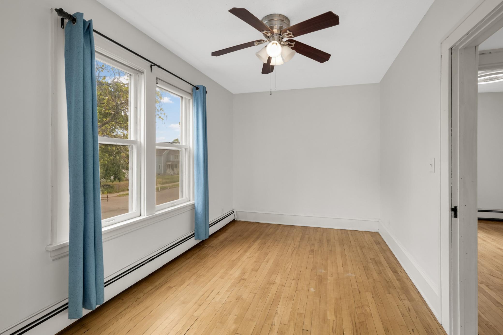 Another spacious bedroom on the upper level with a walk-in closet