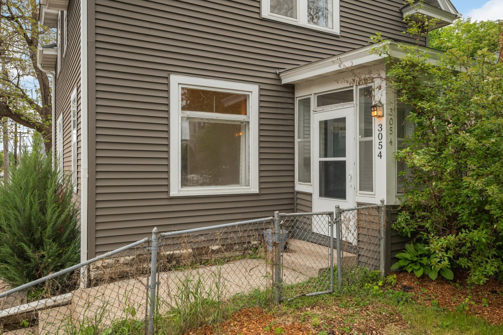 Charming front porch welcomes you into the home