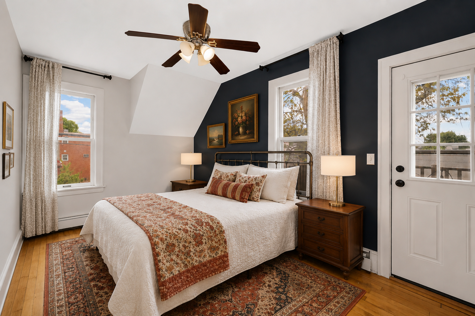 Virtually Staged - this spacious bedroom has a walk-in closet and doorway out to a balcony