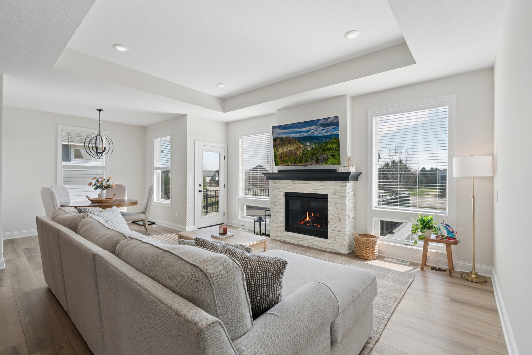 Cozy up to this gorgeous fireplace in the main level living room