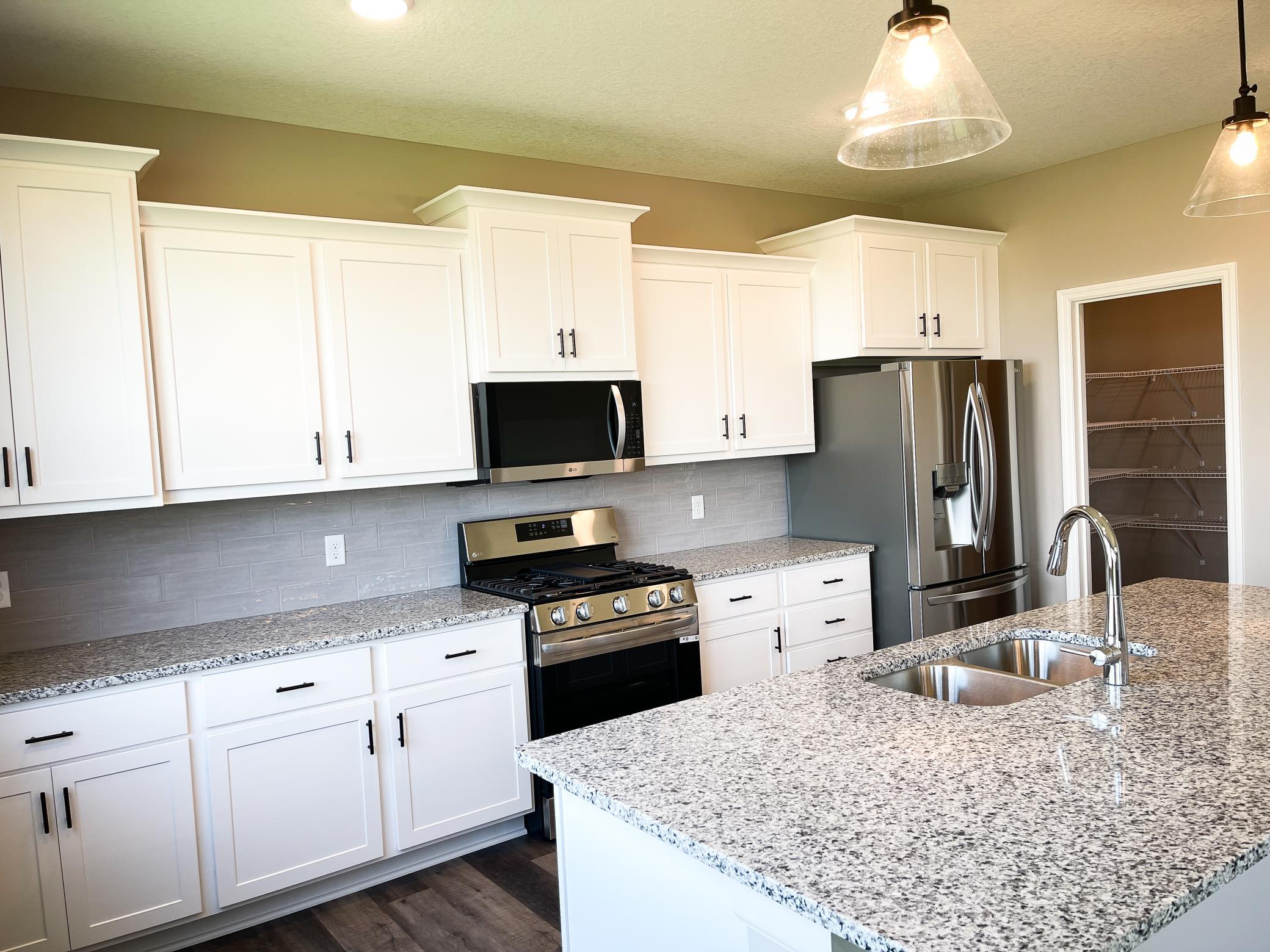 Photo of previously finished home of same floor plan.