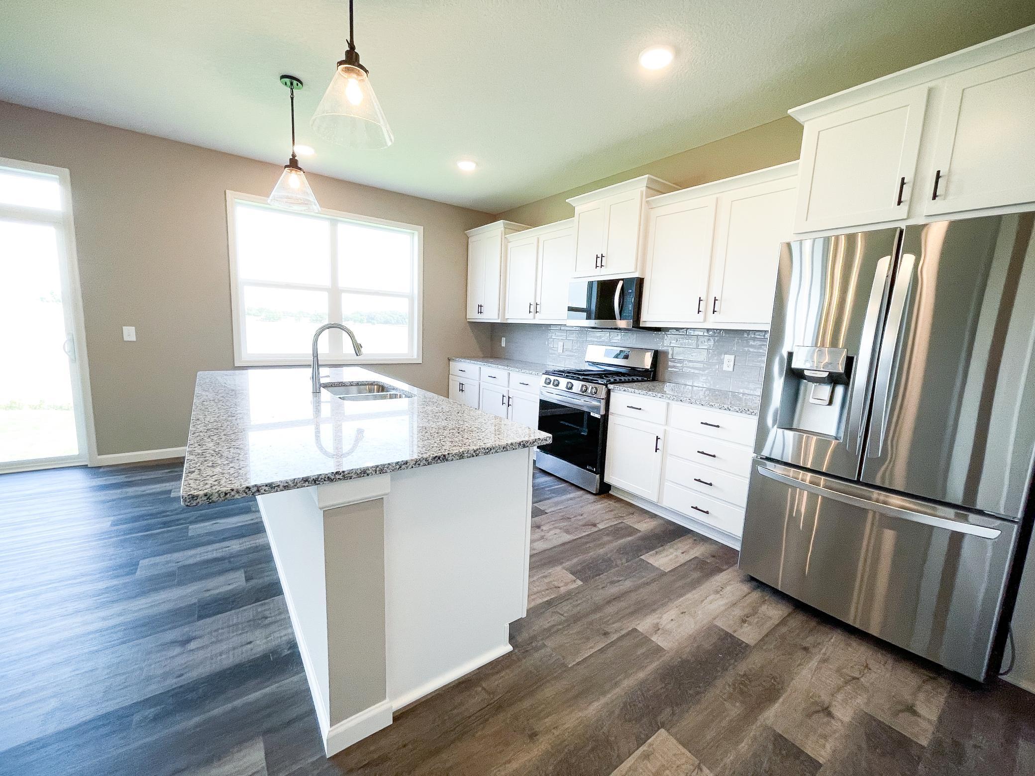 Photo of previously finished home of same floor plan.