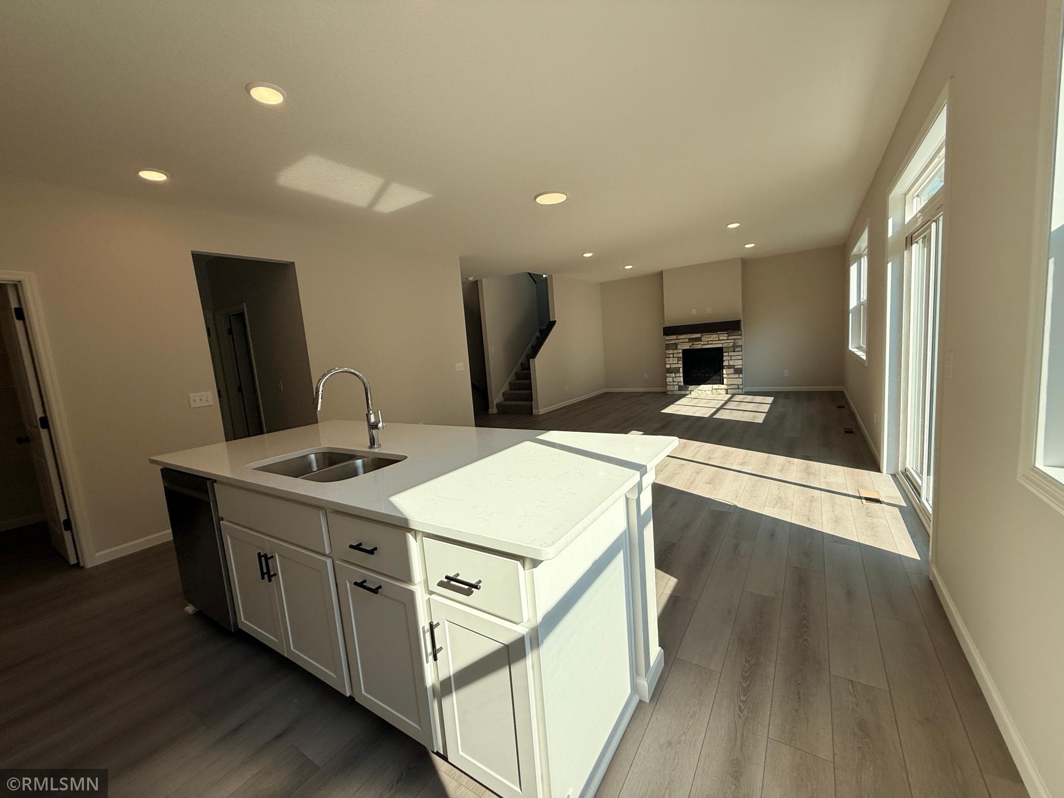 Loads of cabinetry and a huge island make this kitchen the heart of your home.