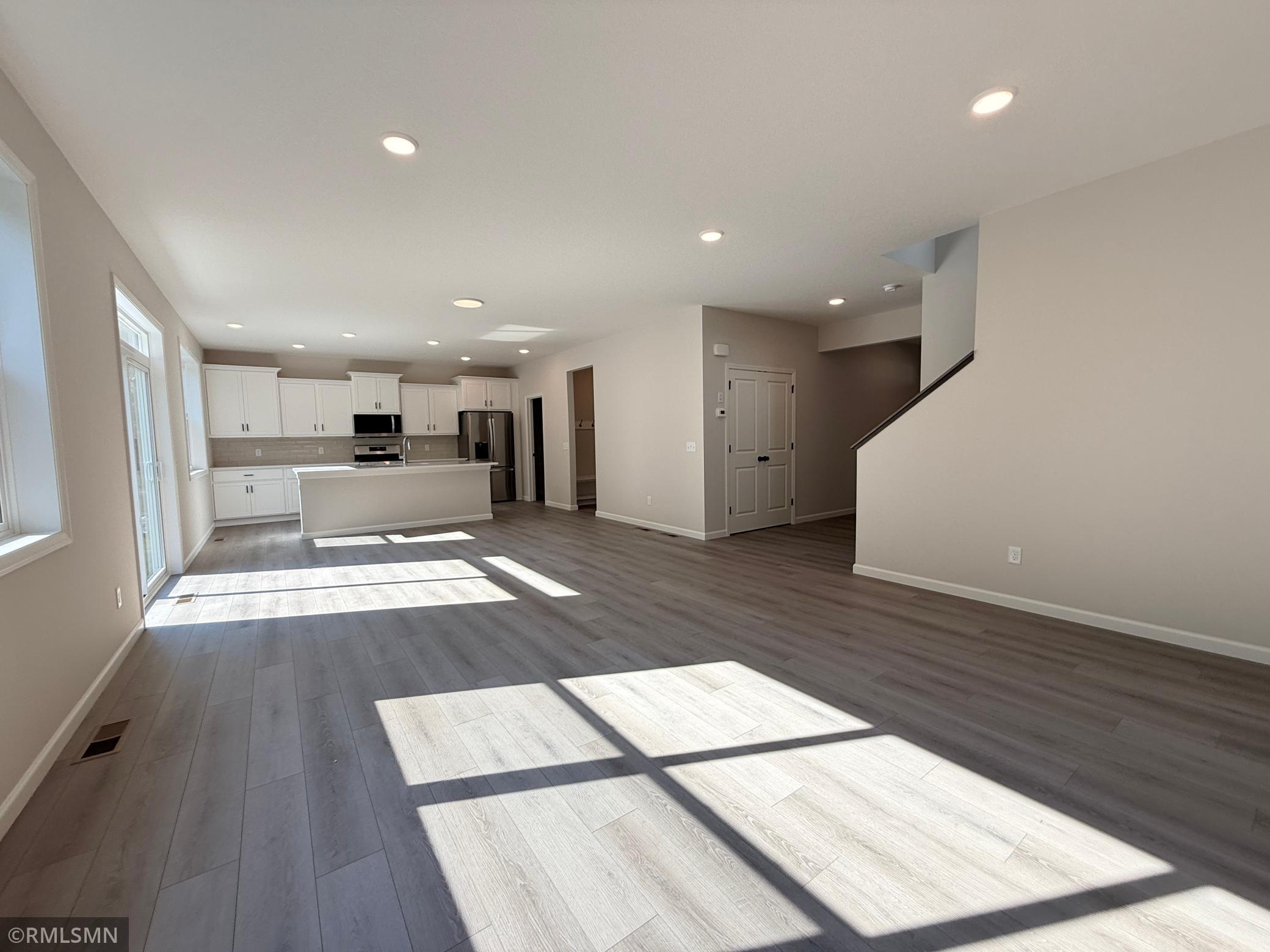 The luxury vinyl plank flooring throughout the main level makes it easy to adjust room boundaries for larger gatherings and entertaining.