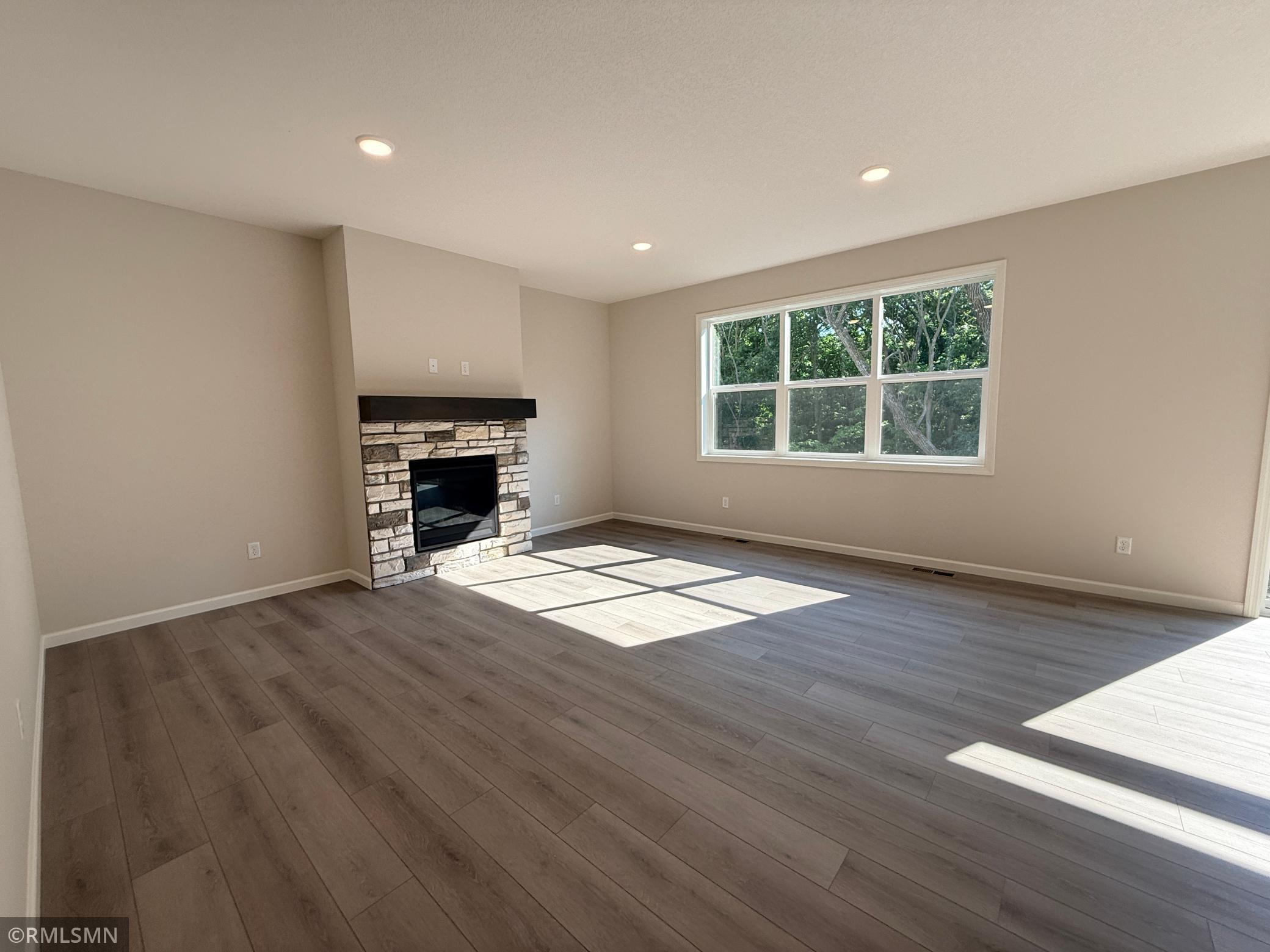 This home's stone fireplace gives you the perfect ambience.