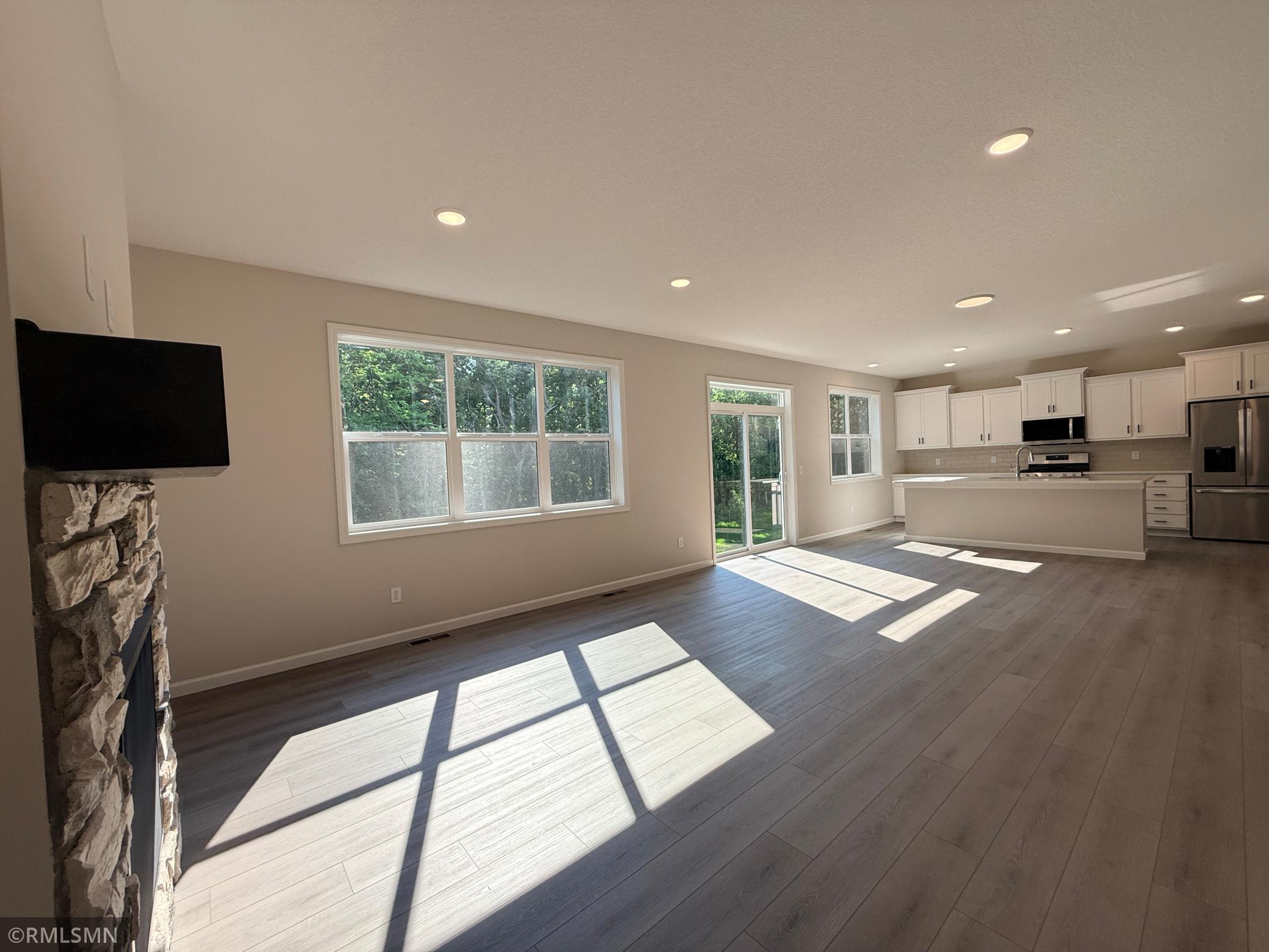 The luxury vinyl plank flooring throughout the main level makes it easy to adjust room boundaries for larger gatherings and entertaining.