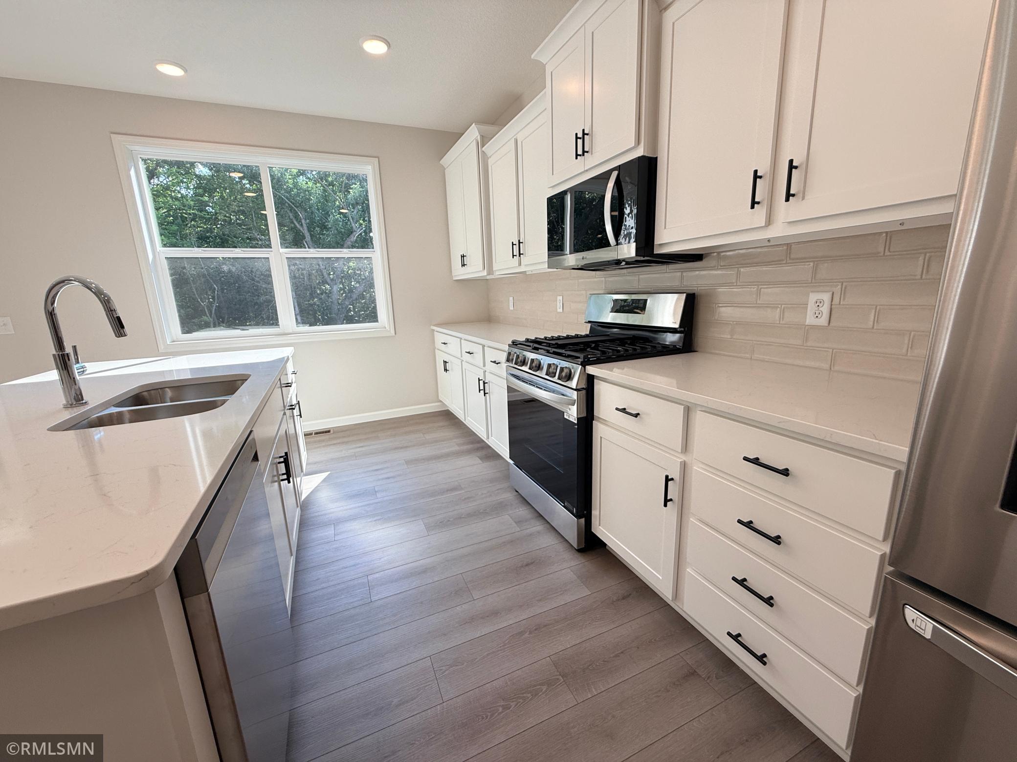 More natural light and great views of the treed backyard.