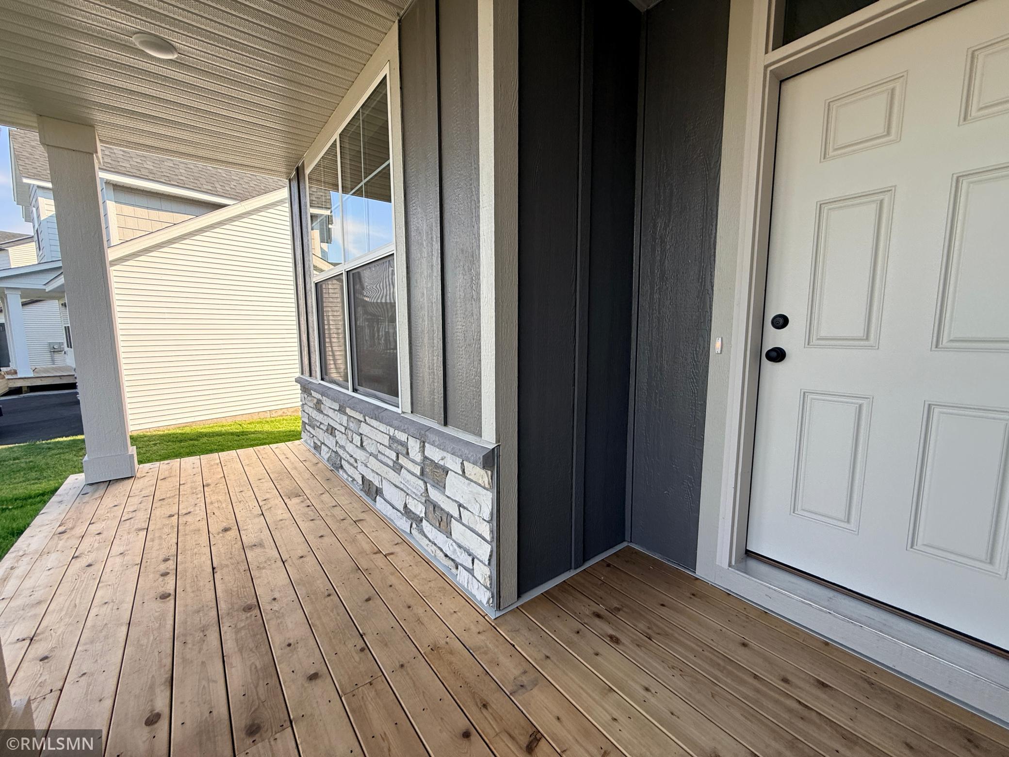 Expansive front porch is so welcoming and versatile!