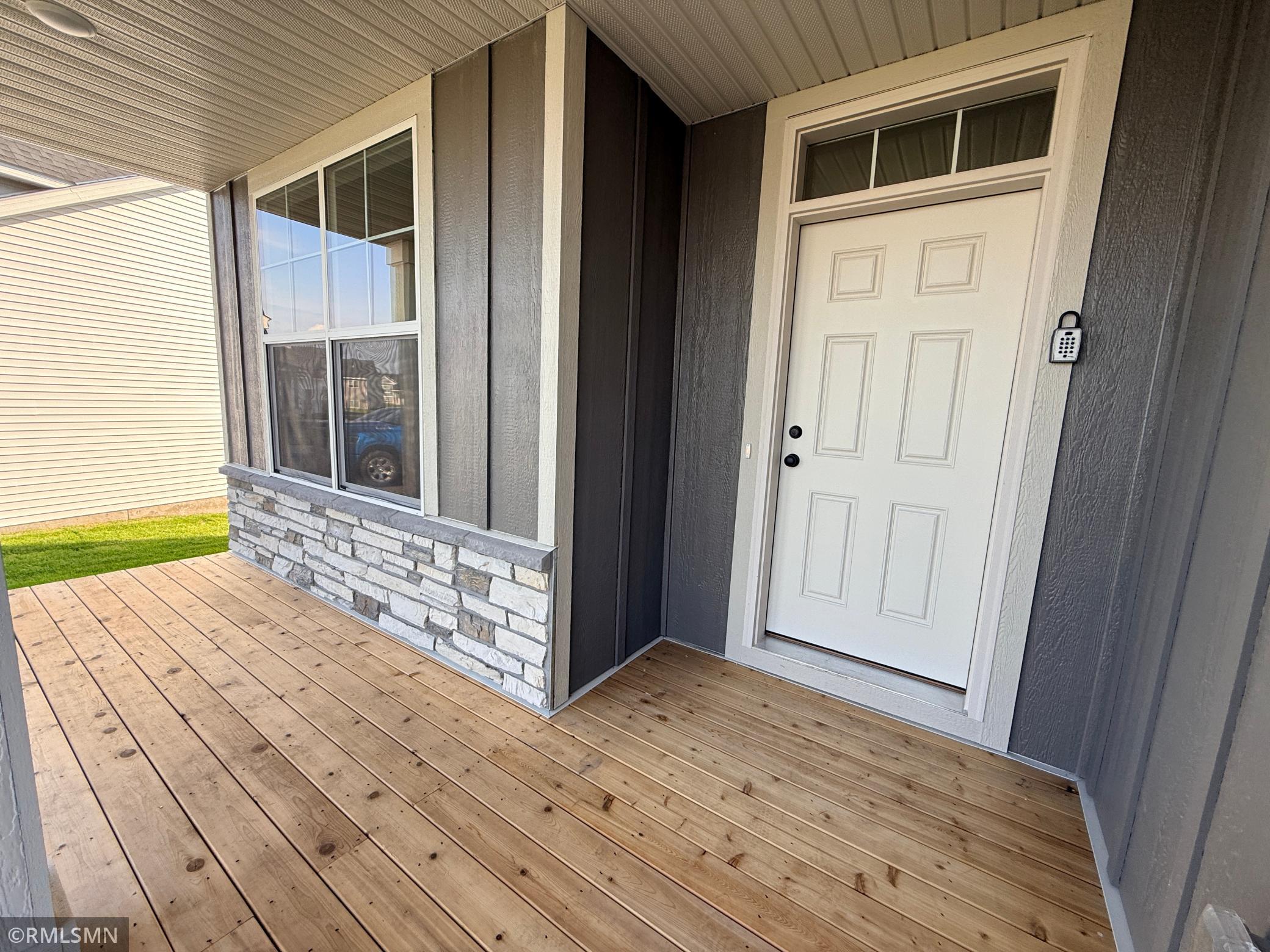 Expansive front porch is so welcoming and versatile!