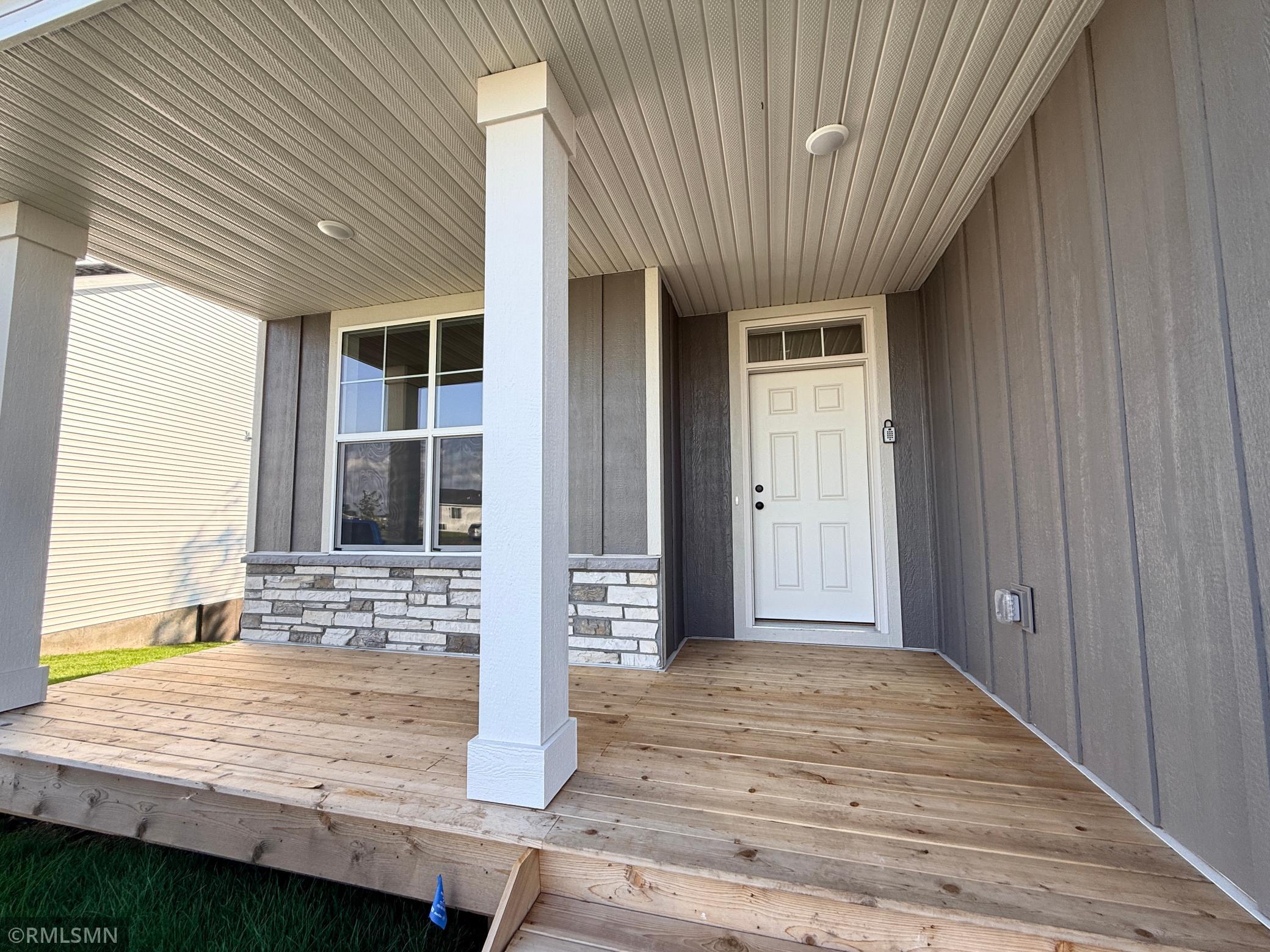 Expansive front porch is so welcoming and versatile!