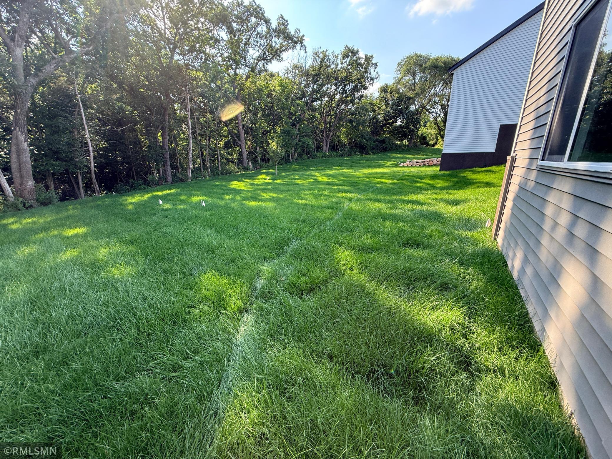 Beautiful backyard extends into the trees over 100 additional feet - see supplements for lot survey.