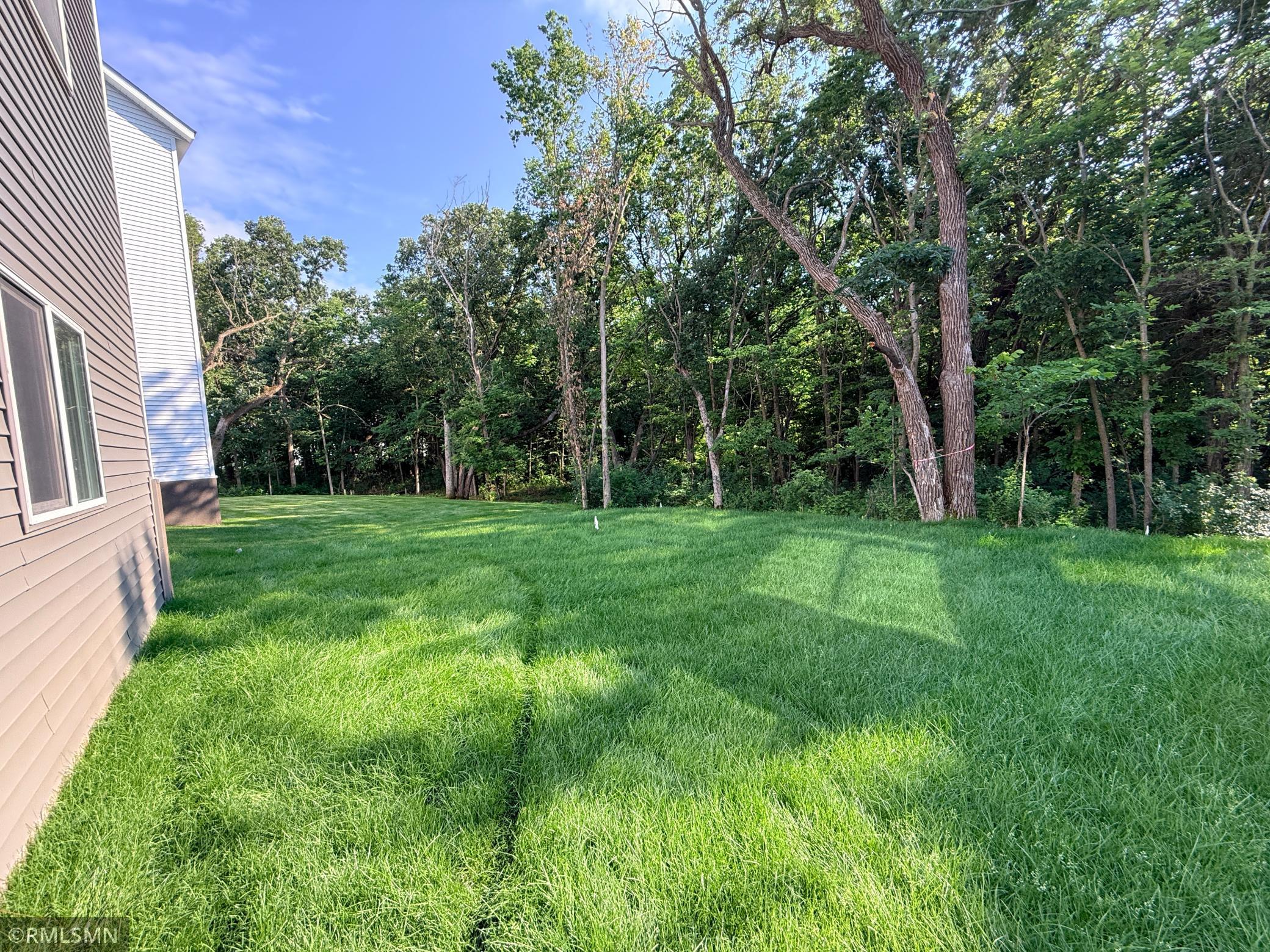 Beautiful backyard extends into the trees over 100 additional feet - see supplements for lot survey.