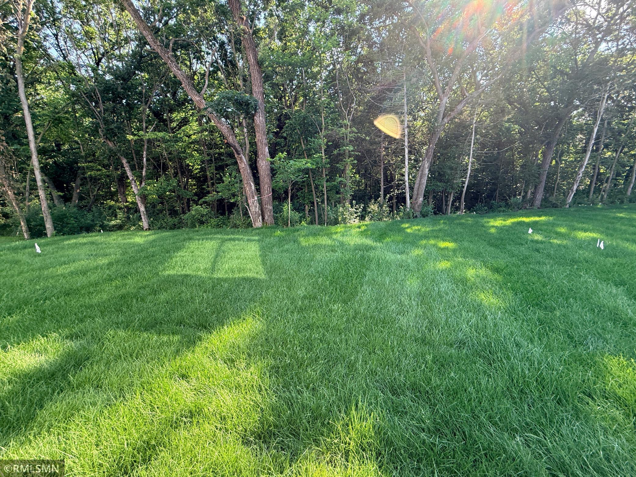 Beautiful backyard extends into the trees over 100 additional feet - see supplements for lot survey.