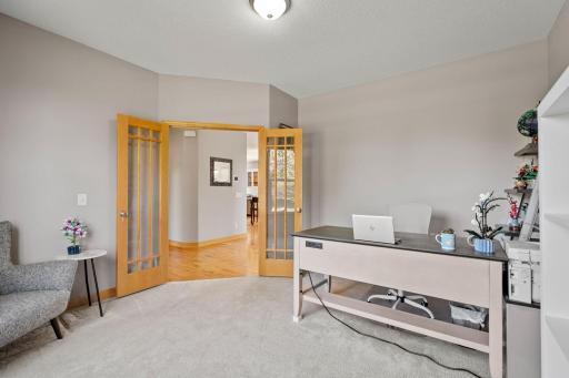 Head through the glass-paned french doors to the front office.