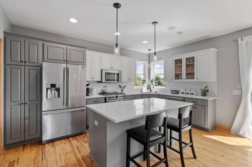 This updated kitchen is suburb. Quartz countertops, high end Fridgedaire appliances, painted cabinetry, and hardware.