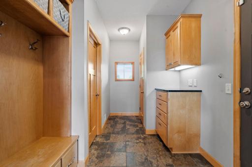 Mudroom and laundry right off the garage makes for a great landing area in every season.