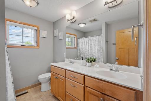 Shared upper level full bathroom with dual vanity sinks!
