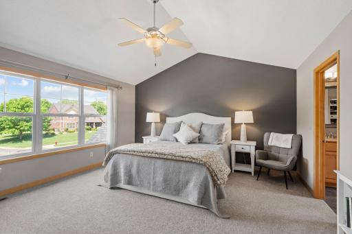 Welcome to your primary suite. With vaulted ceilings, ensuite bathroom, and walkin closet