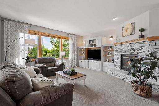 With newer carpet, refreshed built-in cabinetry and gas fireplace.