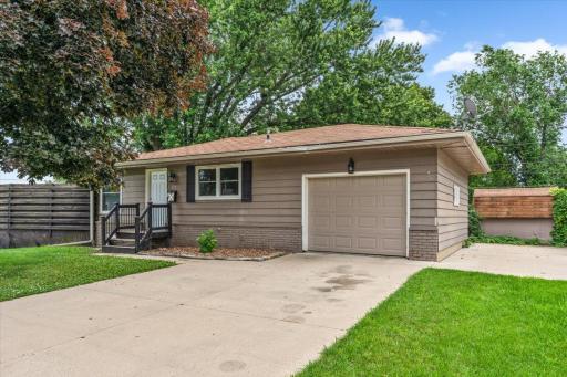 1 Car Attached Garage and extra concrete parking area