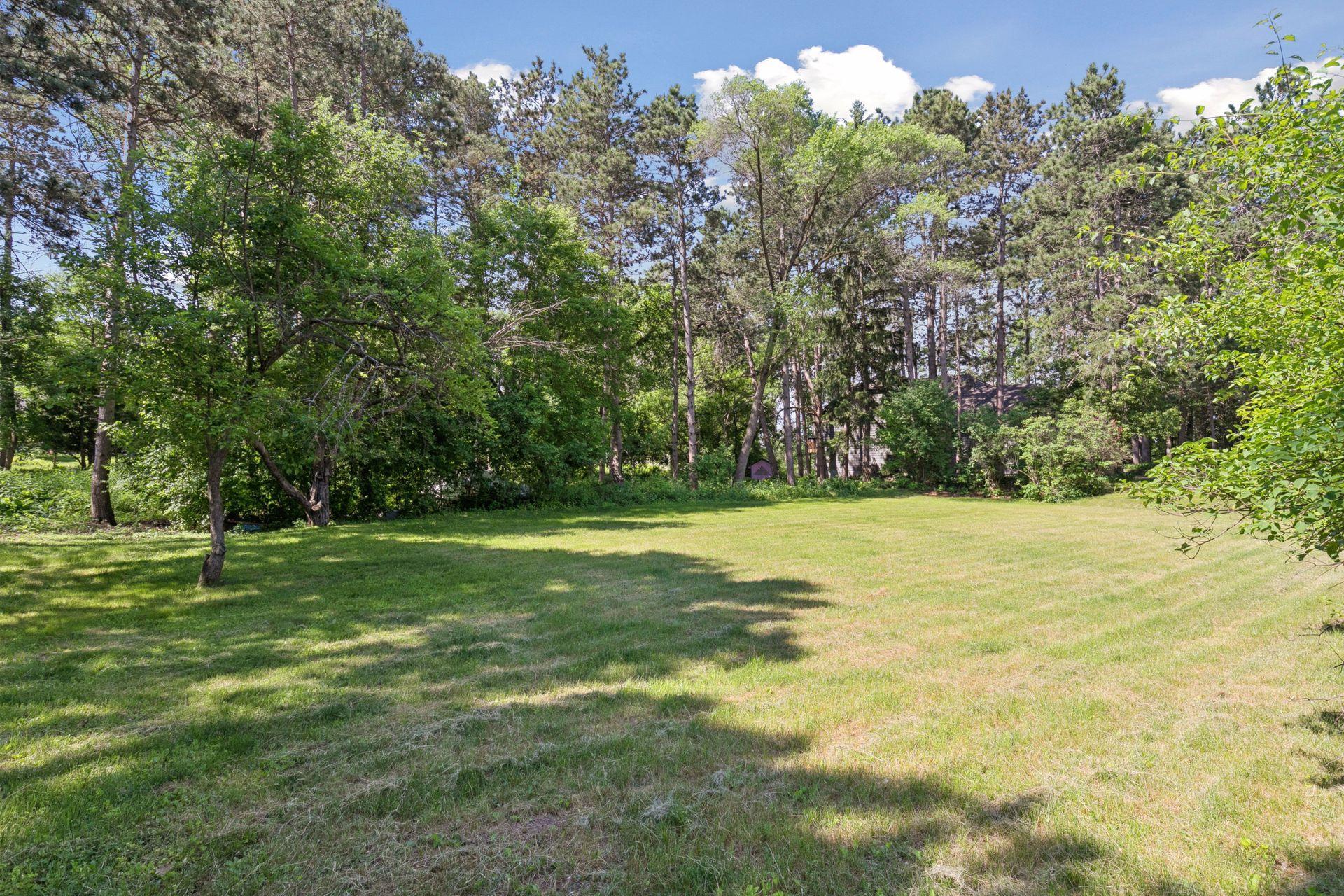Stunning level lot surrounded by mature trees and vegetation!