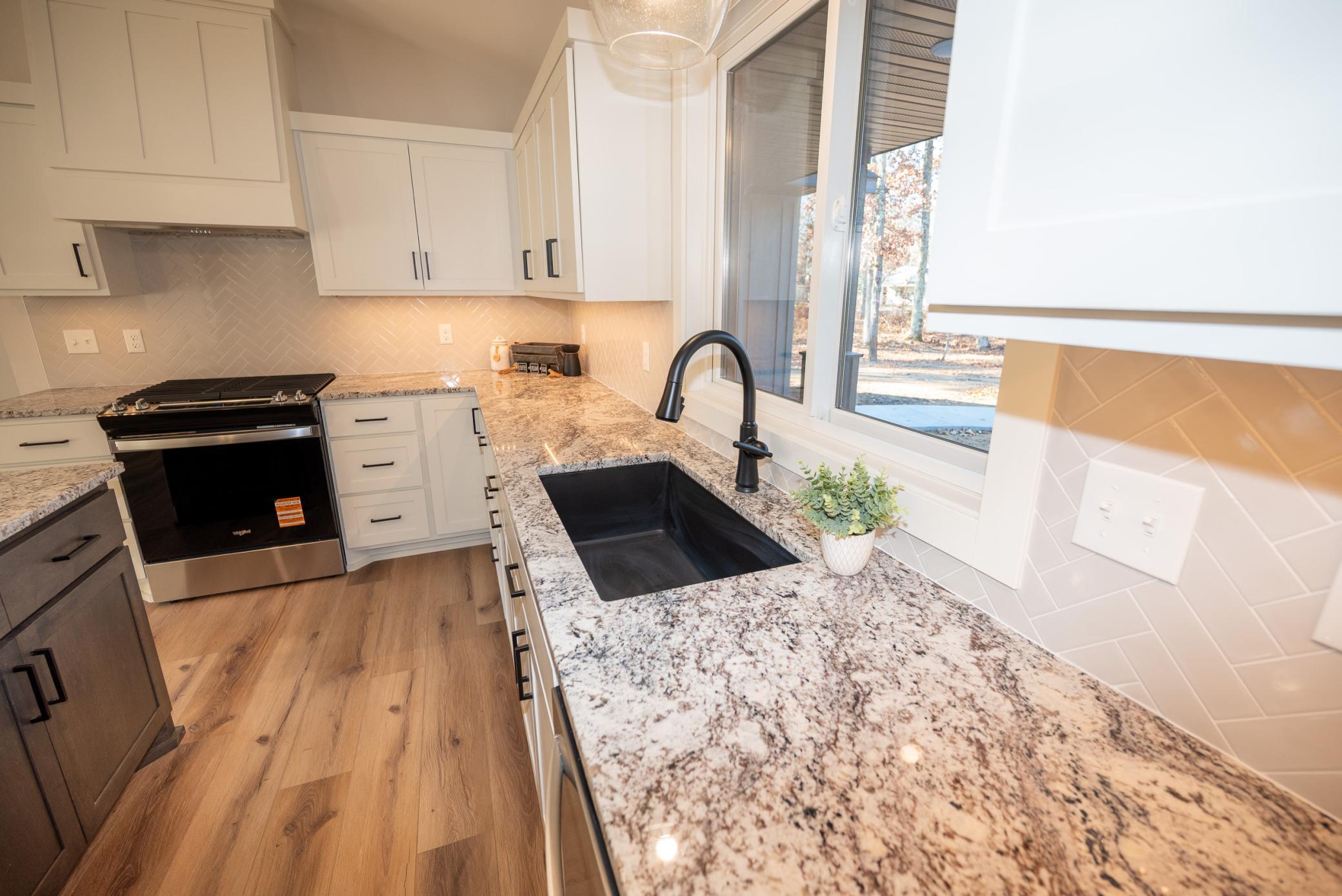 Enjoy cooking in this beautiful kitchen ~ Features custom built cabinets, granite and stainless appliances!