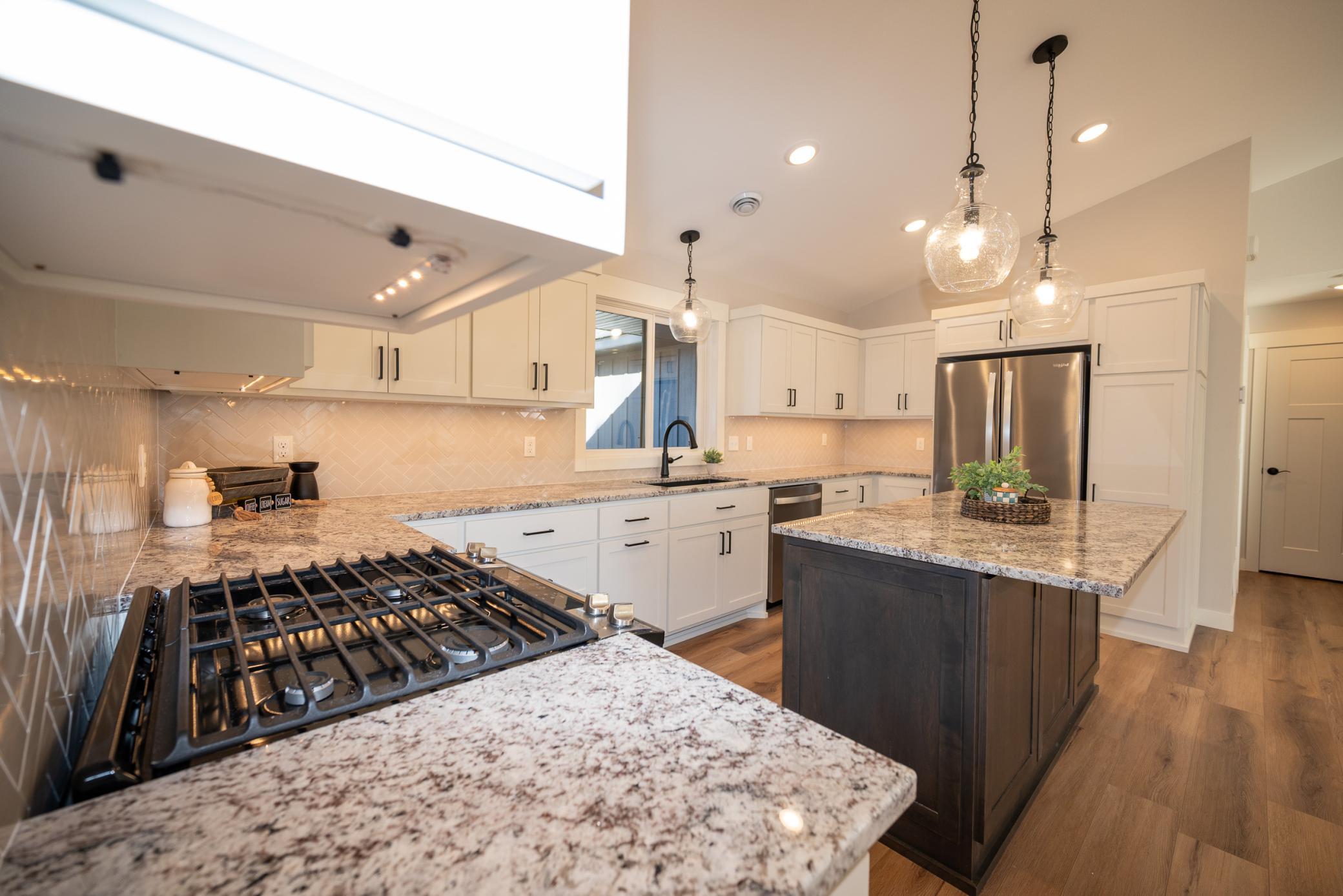 Stainless appliances, gas range and beautiful tiled backsplash!