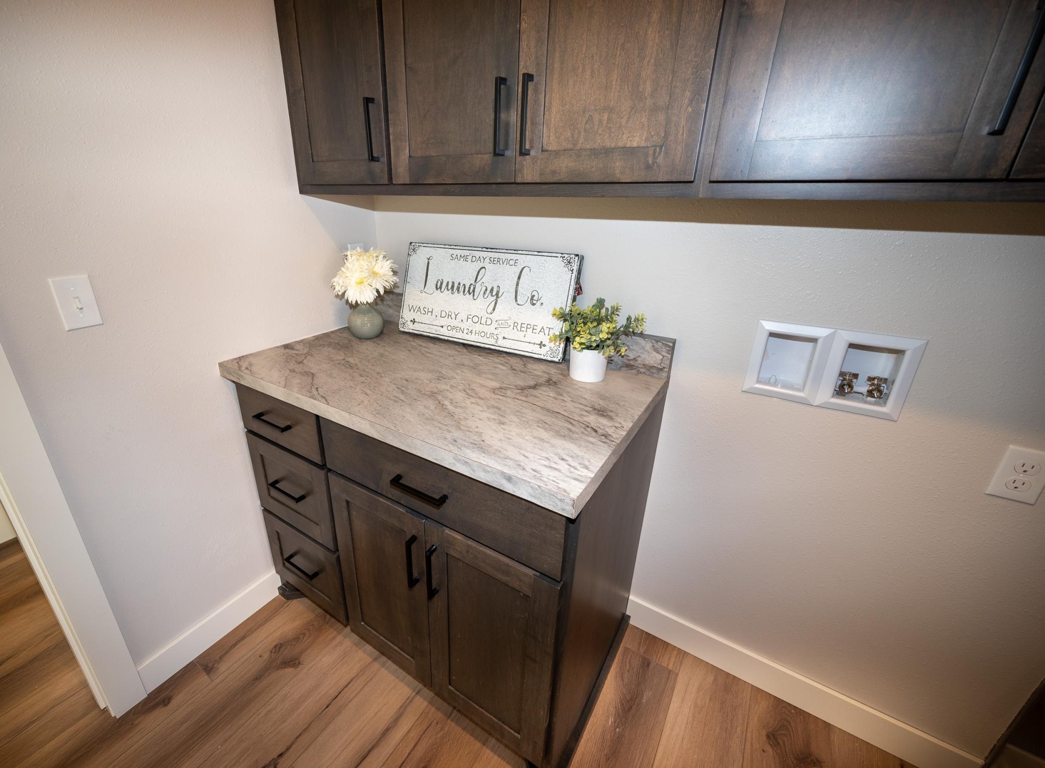 Laundry room features and 36" sink base and plumbed for a future laundry room sink!