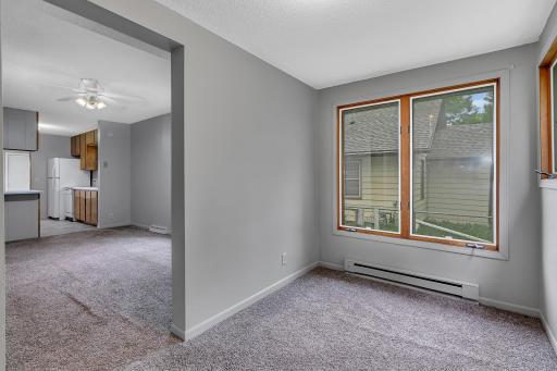 The enclosed front entry offers a flexible space that could easily serve as a cozy home office, reading nook, or sitting area.