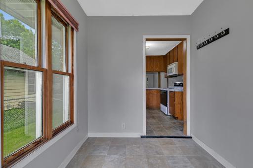 Toward the back entry, a spacious mudroom provides a practical drop zone with a coat hook strip and room for a bench, creating the perfect transition space for busy daily life.